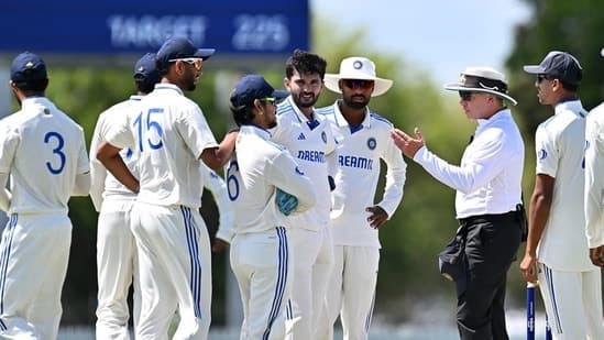 Ishan Kishan and other India A players in conversation with umpire